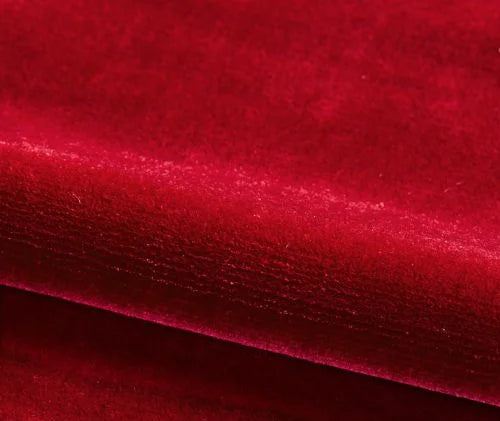 Close-up of red velvet fabric with a textured pattern
Velours Uni – Luxury Silk Fabric -Cramoisi