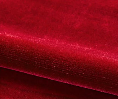 Close-up of red velvet fabric with a textured pattern
Velours Uni – Luxury Silk Fabric -Cramoisi