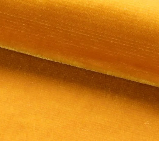 Close-up of yellow velvet fabric with a soft texture
Velours Uni – Luxury Silk Fabric - Topaze