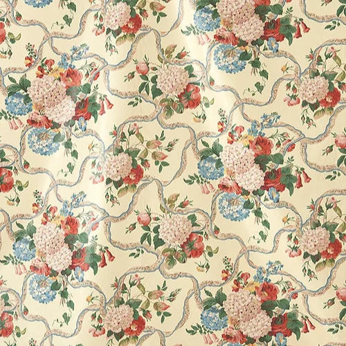 Floral patterned fabric with red, blue, and pink flowers on a beige Farnfield Fabric – 100% Cotton Chintz