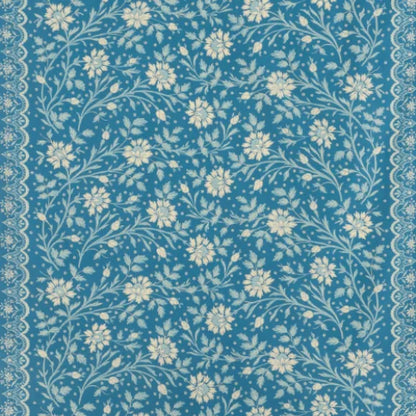 Floral pattern with white flowers on a blue background
Batik Printed Cotton, Bleu